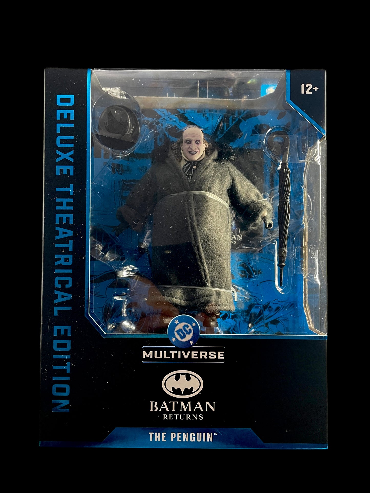 DC Multiverse Batman Returns Penguin Deluxe Theatrical Edition figure with hat and umbrella accessories.