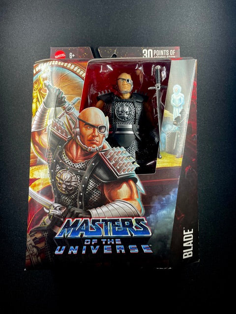 Masters of the Universe Blade action figure by Mattel featuring black armor, eyepatch, sword accessory, and collector packaging