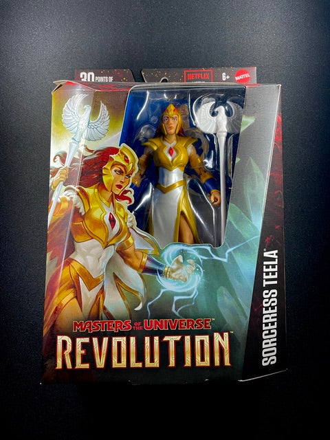 Masters of the Universe Revolution Sorceress Teela action figure with white and gold armor, red hair, and bird-topped staff