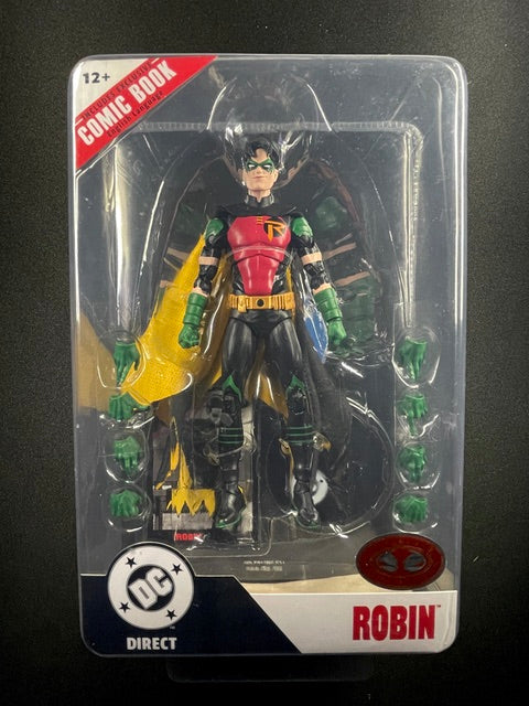 DC Direct Robin action figure featuring red and black armored costume, yellow cape, green gloves, interchangeable hands, and exclusive comic book