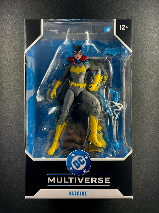 DC Multiverse Batgirl Barbara Gordon 7-inch action figure in grey and yellow suit with grapnel gun accessory.