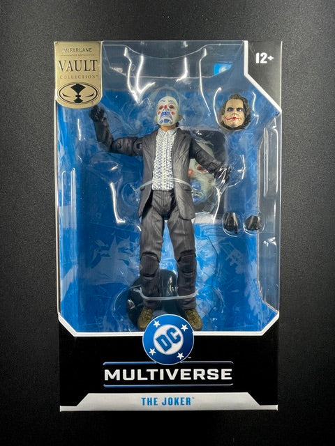 McFarlane Toys DC Multiverse Vault Collection Joker 7-inch action figure with clown mask, alternate unmasked head, dark suit, and interchangeable hands