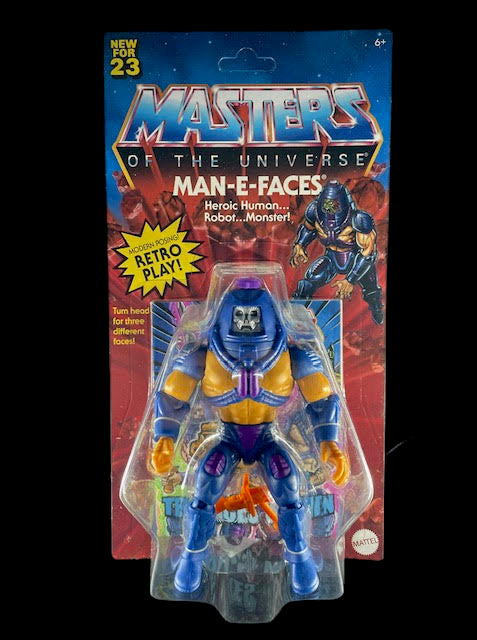 Masters of the Universe Origins Man-E-Faces action figure with rotating heads and orange-blue armor on retro card.