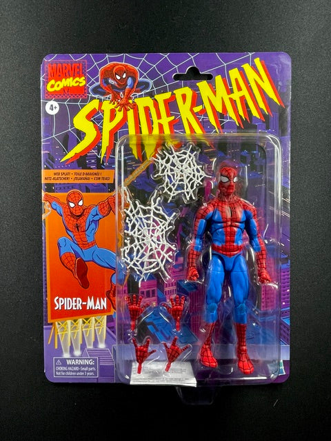 Marvel Legends Retro Spider-Man action figure in classic red and blue costume with interchangeable hands and white web-splat accessories
