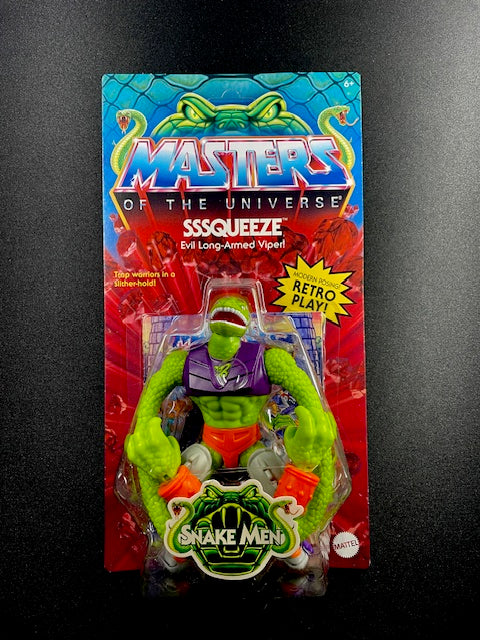 Masters of the Universe Sssqueeze toy figure packaging on a dark background