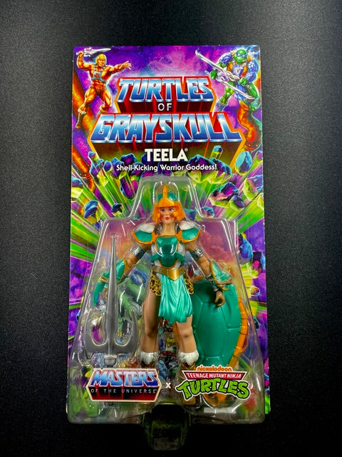 Turtles of Grayskull Teela action figure with turquoise armor, turtle shell shield, and battle weapon