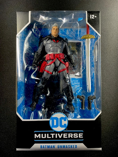 Batman action figure in packaging with DC Multiverse branding on a dark background