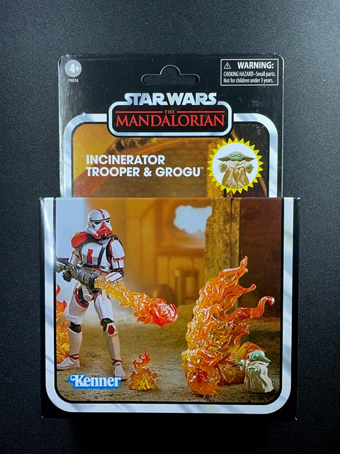 Star Wars The Vintage Collection Incinerator Trooper and Grogu deluxe action figure set with flame effects in Kenner collector packaging.